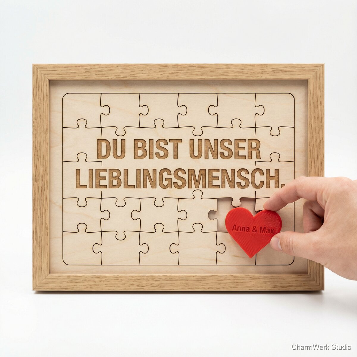 Puzzle-Message im Rahmen mit 3D-Herz als Abschlussstück